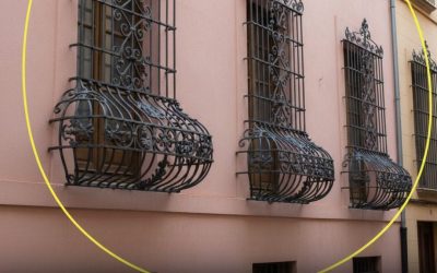 Why are some window bars curved at the bottom